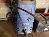 a blue and black power drill sitting on a table