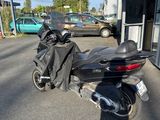 a motorcycle that is parked on the side of the street