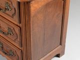 an image of a wooden chest of drawers on a white background