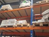 pallet racking in a warehouse with pallets stacked on top of each other