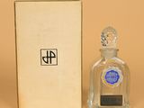 an image of a bottle of liquor next to a box