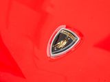 lamb logo on the hood of a red sports car
