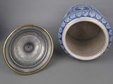 two blue and white vases sitting next to each other on a gray surface
