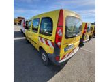a yellow van that is parked in a parking lot