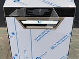 une photo d'un lave-vaisselle posé sur un carton