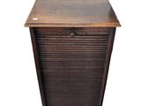 an old wooden cabinet with a drawer on top of it