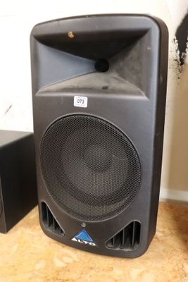 two speakers that are sitting on the floor