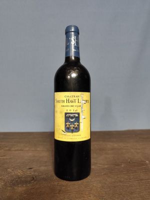 a bottle of wine that is sitting on a table