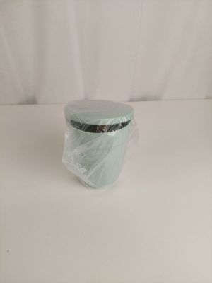 a plastic container with a lid on a white surface