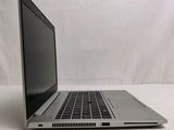 a laptop computer that is sitting on a white surface