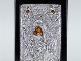 a silver and gold icon of the virgin mary and child jesus