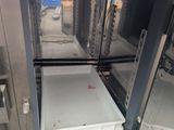 an open oven with a tray inside of it