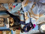a pile of clothing and other items on the floor