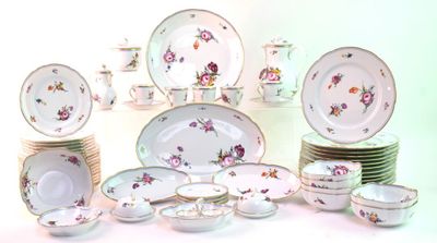 a lot of plates and bowls that are sitting on a table