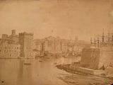 an old photo of a city on the water