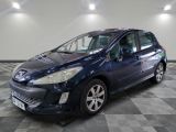 a picture of a blue car parked in a garage
