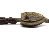 an image of a small wooden object with a handle and a piece of wood in the shape of a turtle