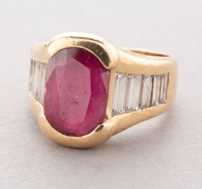 an oval ruby and diamond ring