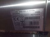 a label on the side of a stainless steel refrigerator
