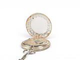 a small pocket watch with a key on a chain