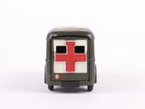 a small toy truck with a red cross on the front