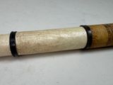 an old telescope that is laying on a table