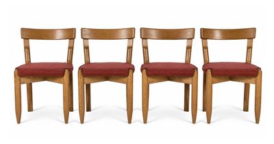 three wooden chairs with red upholstered seats on a white background
