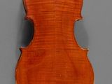 an old violin with a wooden back and a long neck