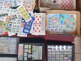 boxes of stamps and stamps are stacked on top of each other