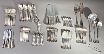many spoons and forks laid out on the table