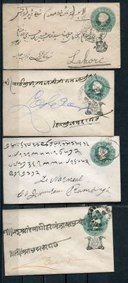 four pieces of paper with writing on them sitting on a table