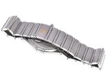 a close up of a watch on a white surface