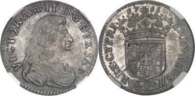 a close up of a coin with a crown on top of it