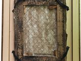 a picture of an old picture hanging on a wall