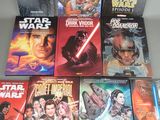 several star wars books sit on a table next to each other