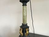 a lamp that is sitting on a table with a lamp on top of it