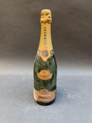 a close up of a bottle of champagne on a table
