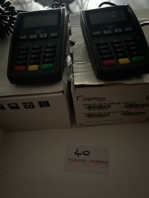 two phones that are sitting on top of a box