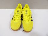 yellow adidas sneakers with black and white soles