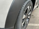 a close up view of a car ' s tire on the street