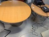 a table with a phone and a laptop on it