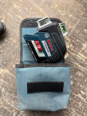 a blue case with a camera and a cell phone in it
