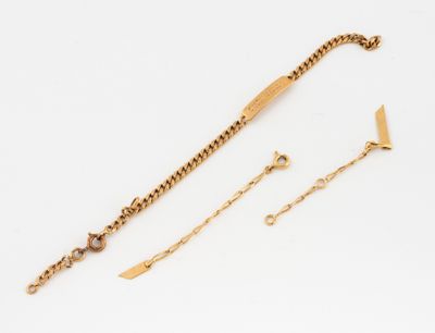 a close up of a gold bracelet and a gold chain