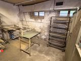 a room that has a lot of shelves and racks in it