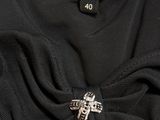 a black dress with a bow on the front