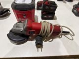 a picture of a corded sander and other tools on a table