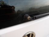 a close up of a vw logo on the side of a car