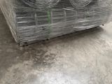 several rolls of wire are stacked on top of each other in a warehouse