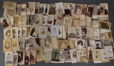 an old photo of a bunch of old photos on a table