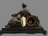 a statue of a woman sitting on top of a clock